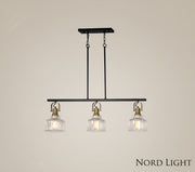 שלישיית רטרו על מסילה – גוף תאורה תלוי בעיצוב זכוכית מחורצת