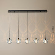 תליית “זוהר חמישייה” – גוף תאורה יוקרתי עם חמישה גלילי זכוכית קריסטל